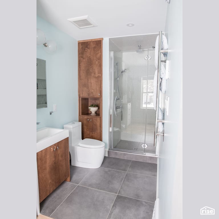 Grey tiled flooring in bathroom with Dual Flush Toilet by Reimagine Designs