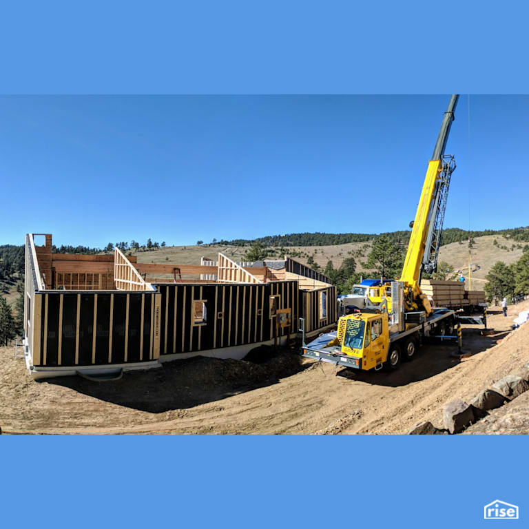 Panelized prefab Passive House with crane on site with Prefabricated Panelized Home by Phoenix Haus LLC