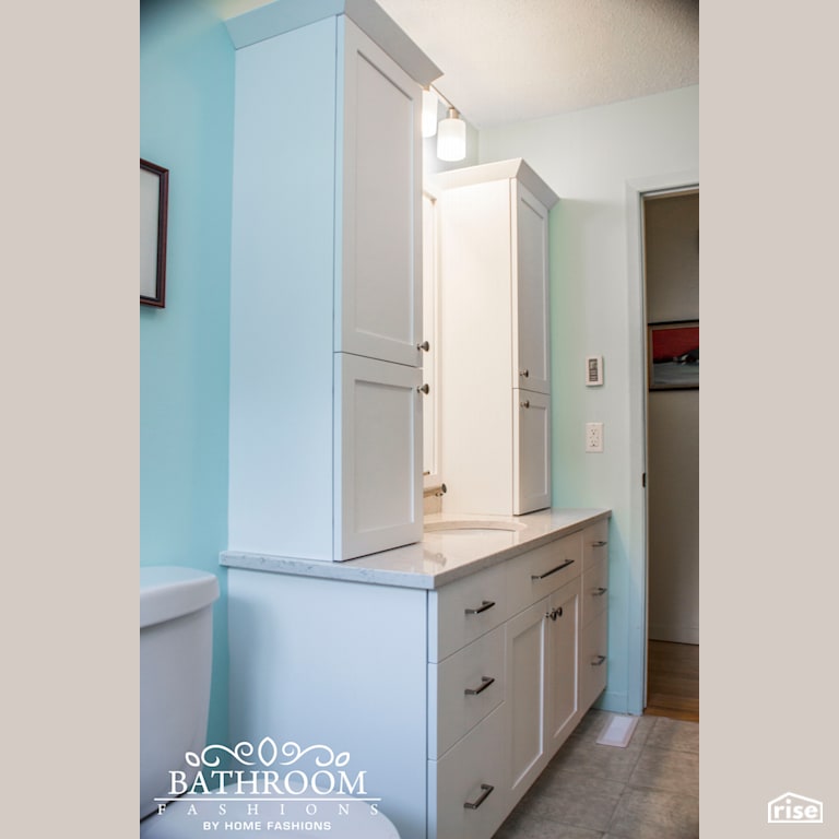 Bathroom Fashions - White and Teal Bathroom with Low-Flush Toilet by Home Fashions