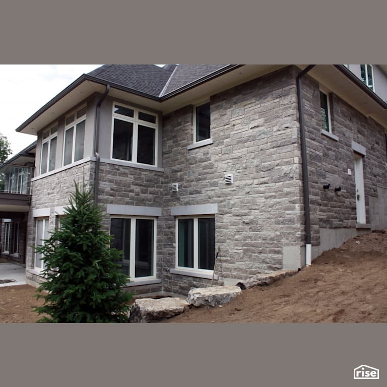 Rear exterior with stone siding with Stone Siding by Masonal Stone Inc