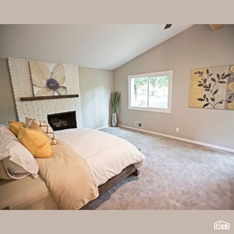 Master Bedroom with Gas Fireplace by Constructive Builders