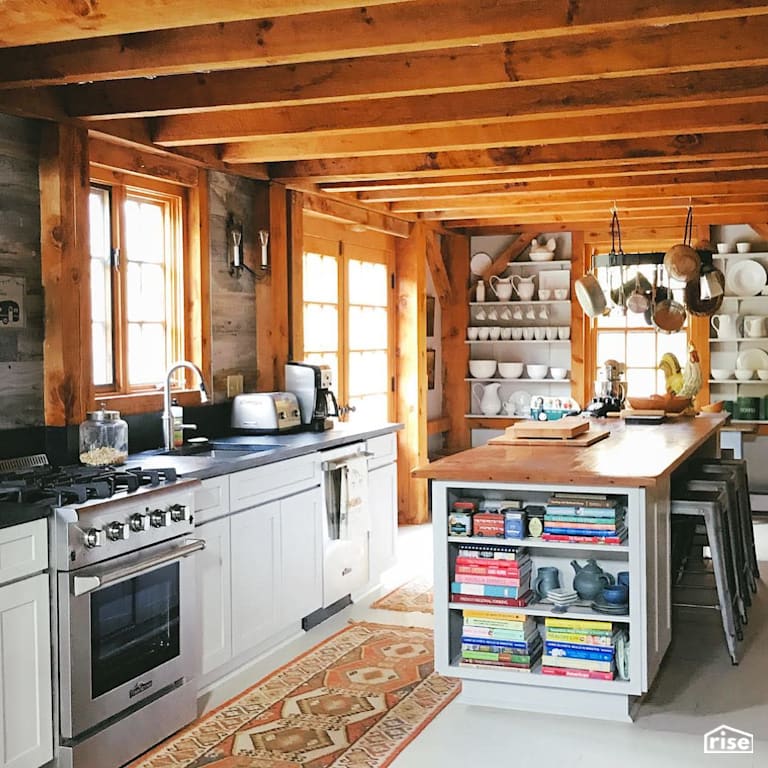 Rustic kitchen with finished countertop, windows and rafters with Interior Wood Finish by Vermont Natural Coatings
