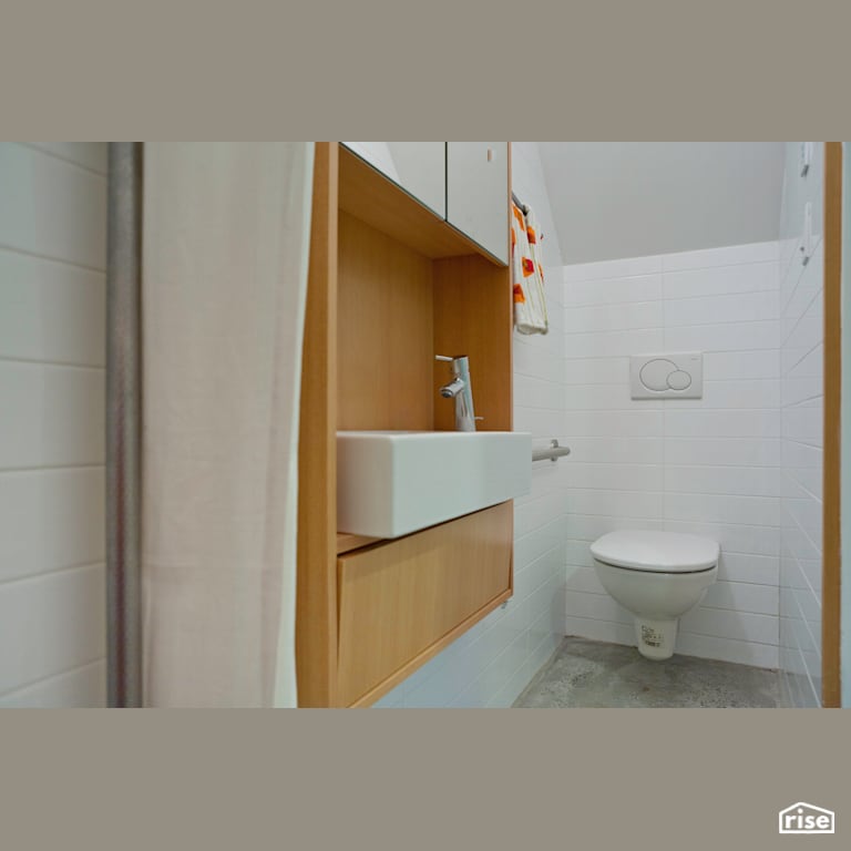 Solar Lane House Bathroom with Wall-hung Dual Flush Toilet by Lanefab Design/Build