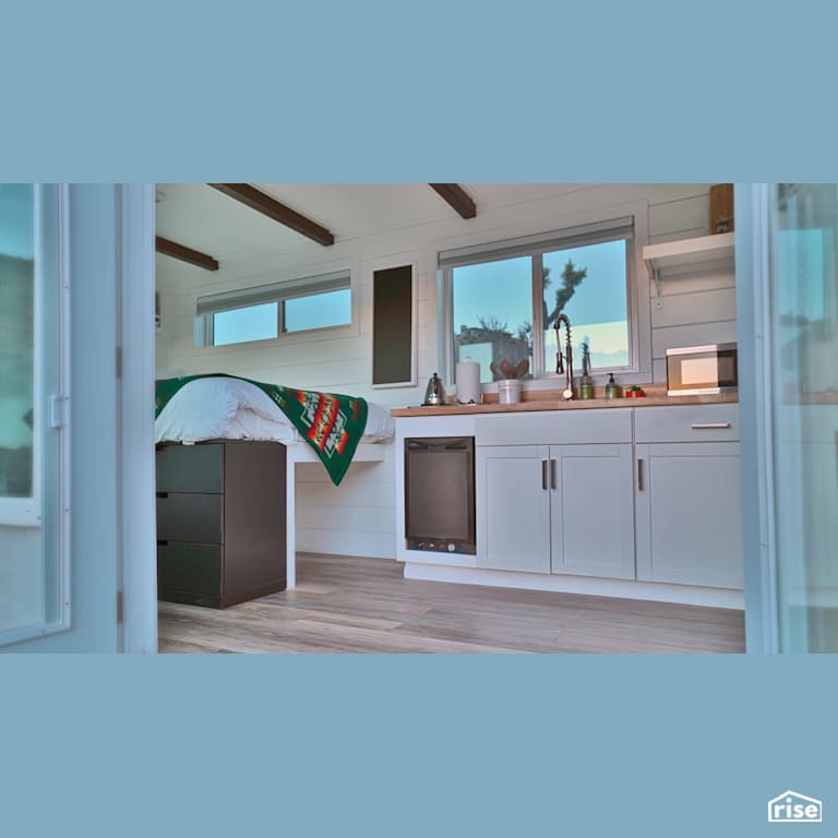 Container Home With White Kitchen with Wood Veneer Cabinet by Alternative Living Spaces
