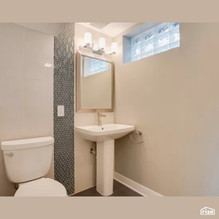 Bathroom with Dual Flush Toilet by Constructive Builders