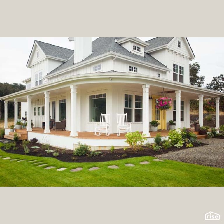 Modern Farm House Exterior with Wood Mulch by Winsome Construction