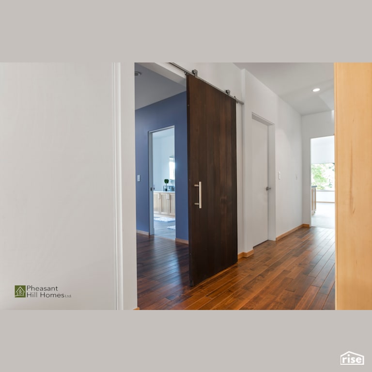 Barndoor with Solid Wood Door by Pheasant Hill Homes Ltd.