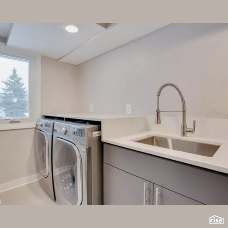 Laundry Room with Integrated LED by Constructive Builders