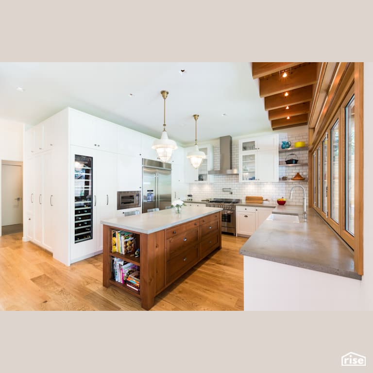 Kitchen with Wall of Cupboards with Stone Countertop by Synthesis Design