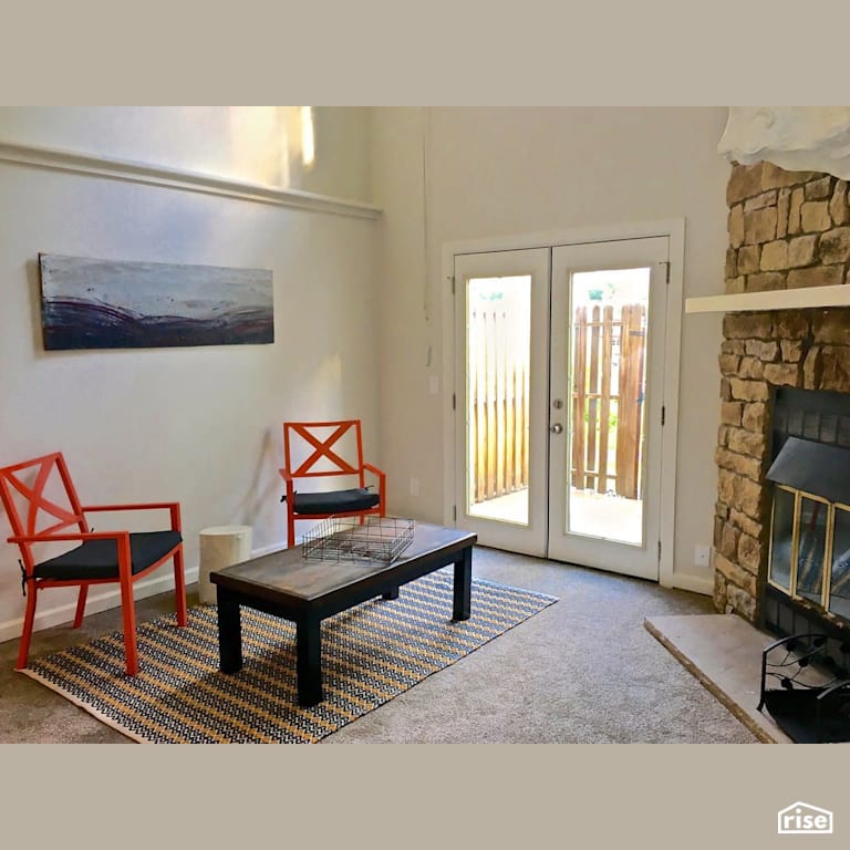 Back entryway with wood fireplace with Energy Star Exterior Door by Revolve Design Build