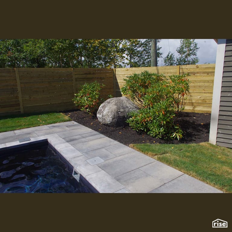 Pool landscaping with Wood Mulch by Earthworks Landscape & Design