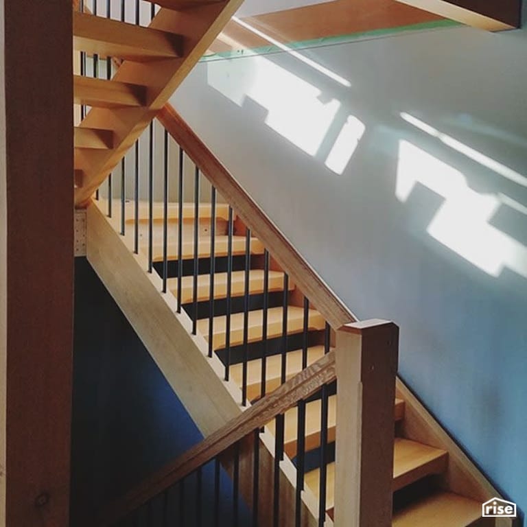 Finished hardwood staircase with metal balusters with Interior Wood Finish by Vermont Natural Coatings