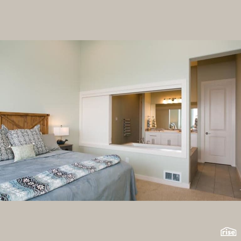 Bedroom with ensuite with Low-Flow Bathroom Faucet by Winsome Construction