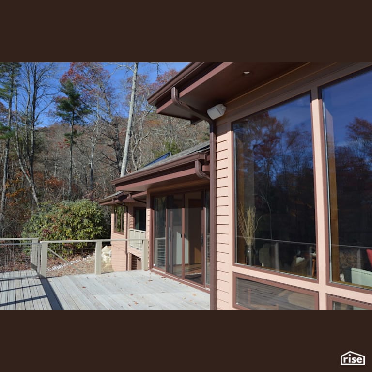 Large windows overlooking the spacious rear deck. with Cedar Decking by Alpen High Performance Products