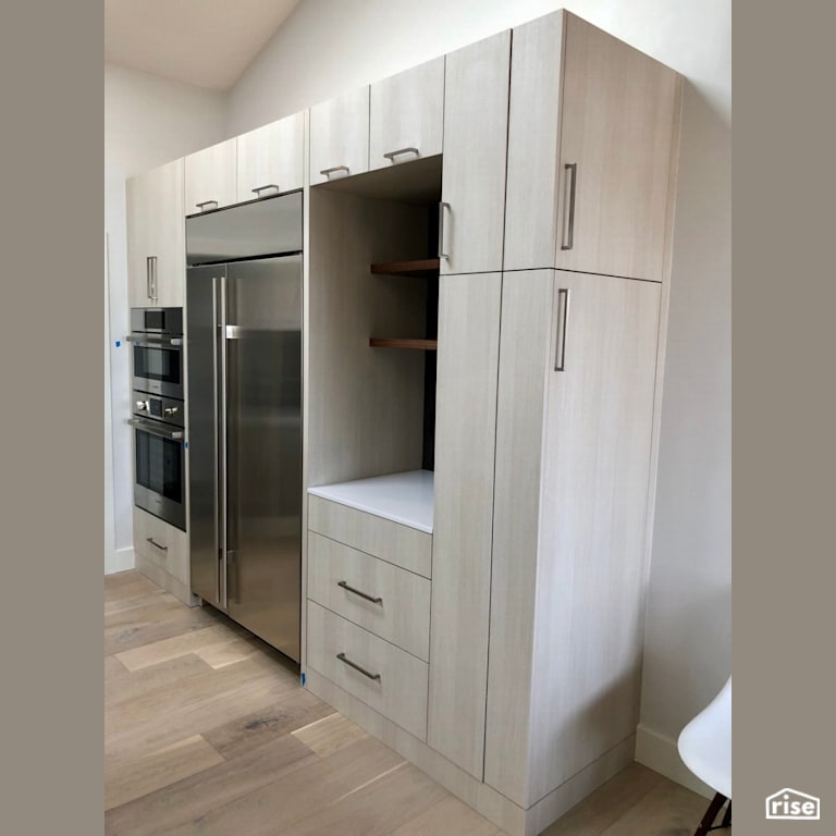 Grey wood veneer cabinets with stainless steel appliances with Wood Veneer Cabinet by Revolve Design Build