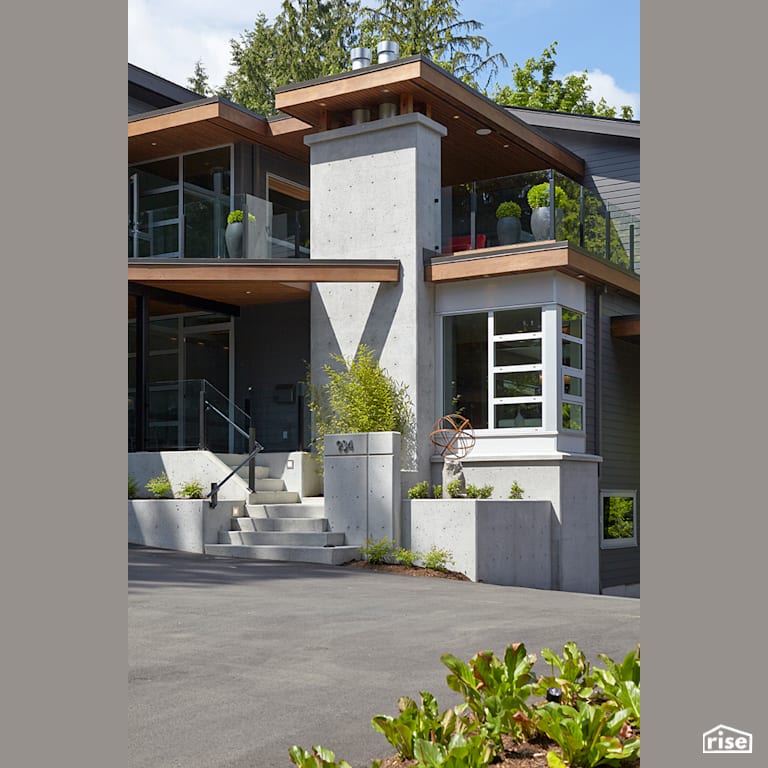 Front Exterior with Accent Outdoor Lighting by My House Design/Build Team Ltd.