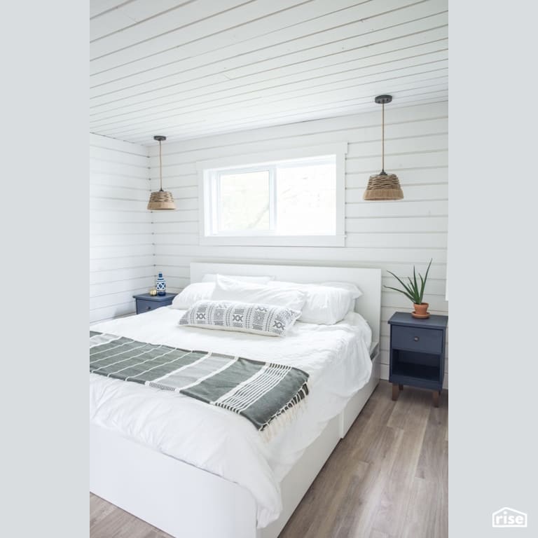 Cottage Master Bedroom with Laminate Flooring by Reimagine Designs