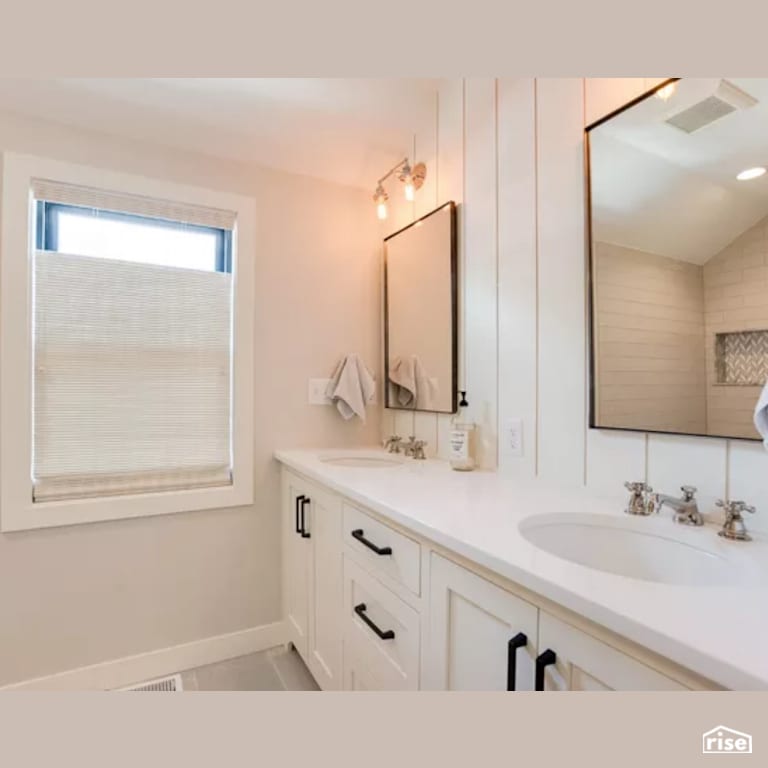 Bathroom with Low-Flow Bathroom Faucet by Constructive Builders