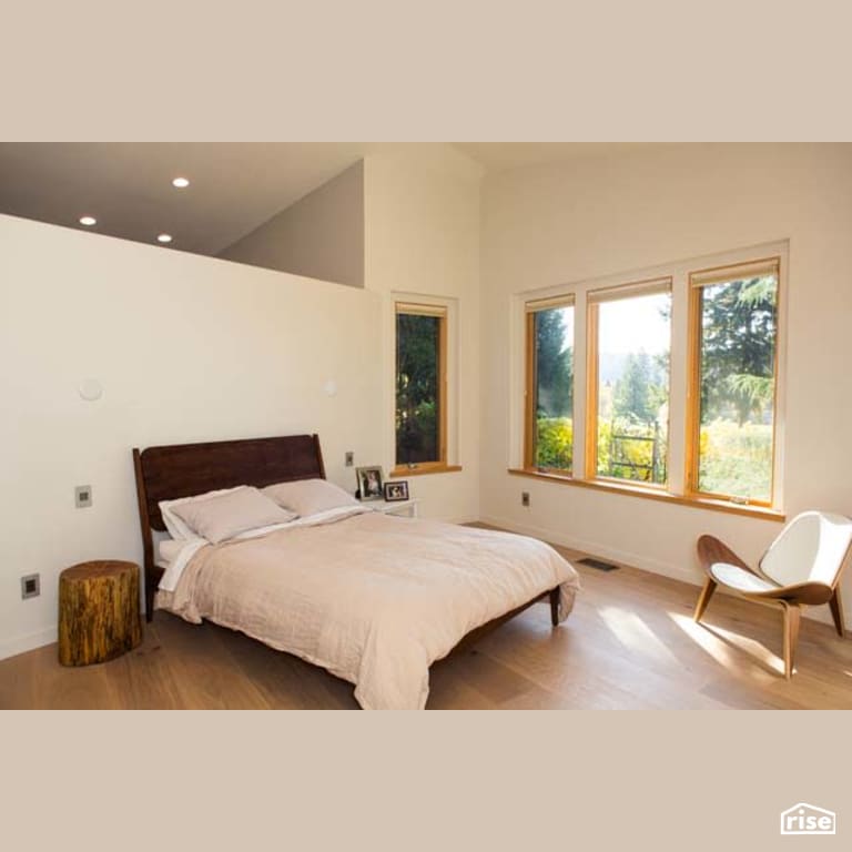 Bedroom with Laminate Flooring by Winsome Construction