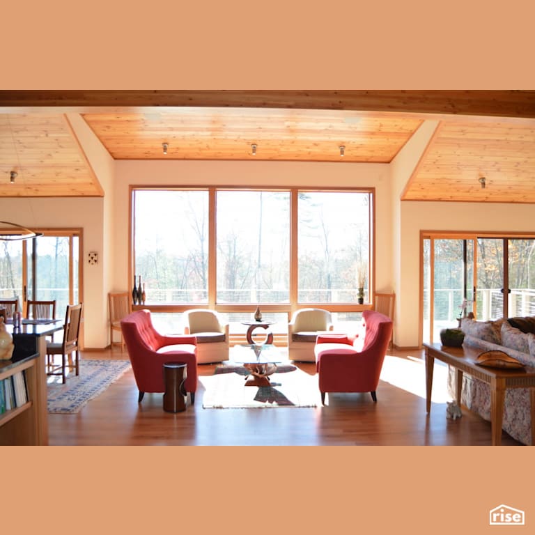 Living room with natural light and natural wood finishes with Laminate Flooring by Alpen High Performance Products