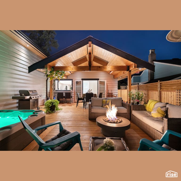 Next-Level Outdoor Kitchen and Lounge Area with Cedar Decking by Synthesis Design