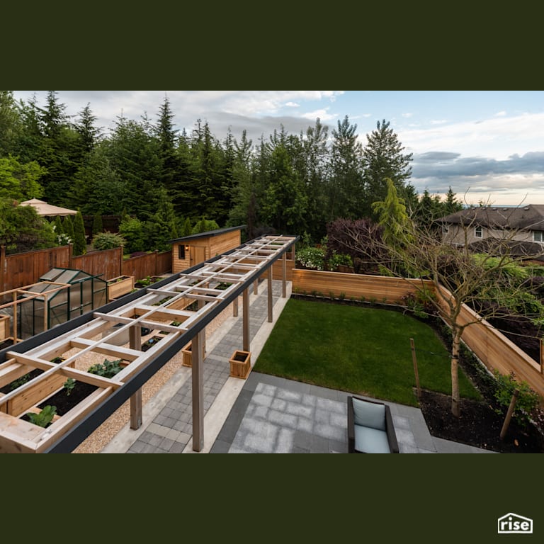 Backyard with Outdoor Gardens by My House Design/Build Team Ltd.