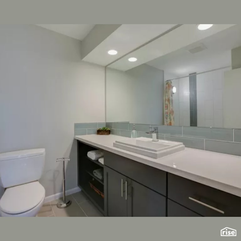 Bathroom with Ceramic Tile Floors by Constructive Builders