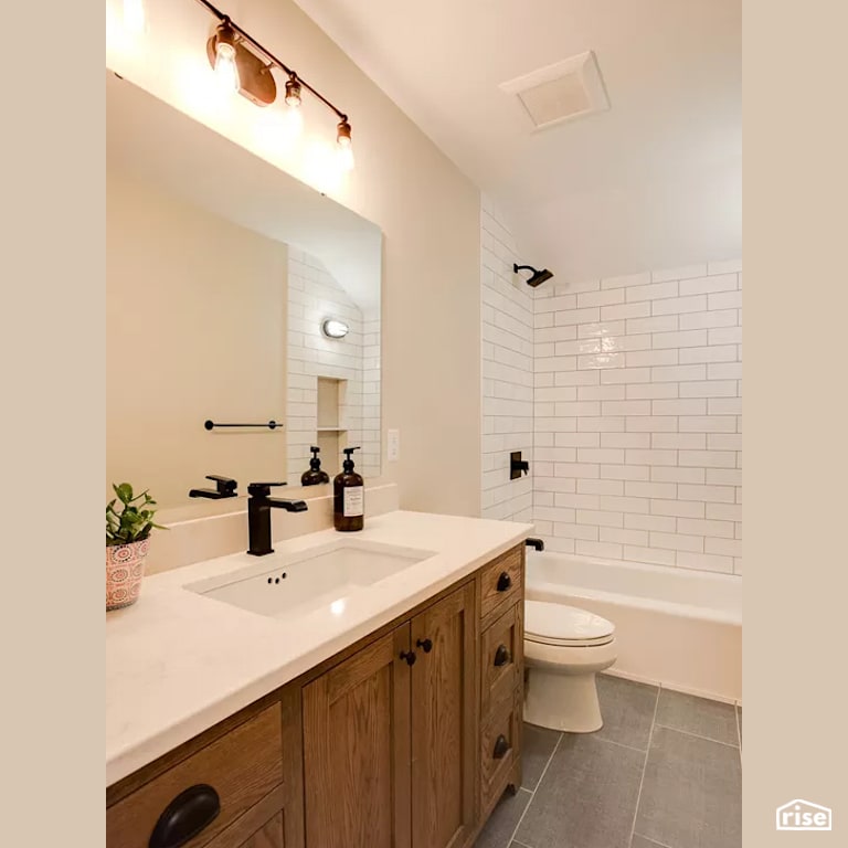 Bathroom with Low-Flow Bathroom Faucet by Constructive Builders