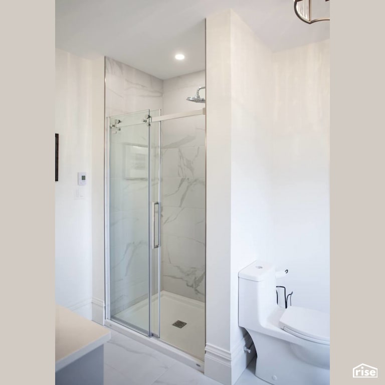 Bright white standup shower bathroom refresh with Low-Flow Showerhead by J Russon Construction