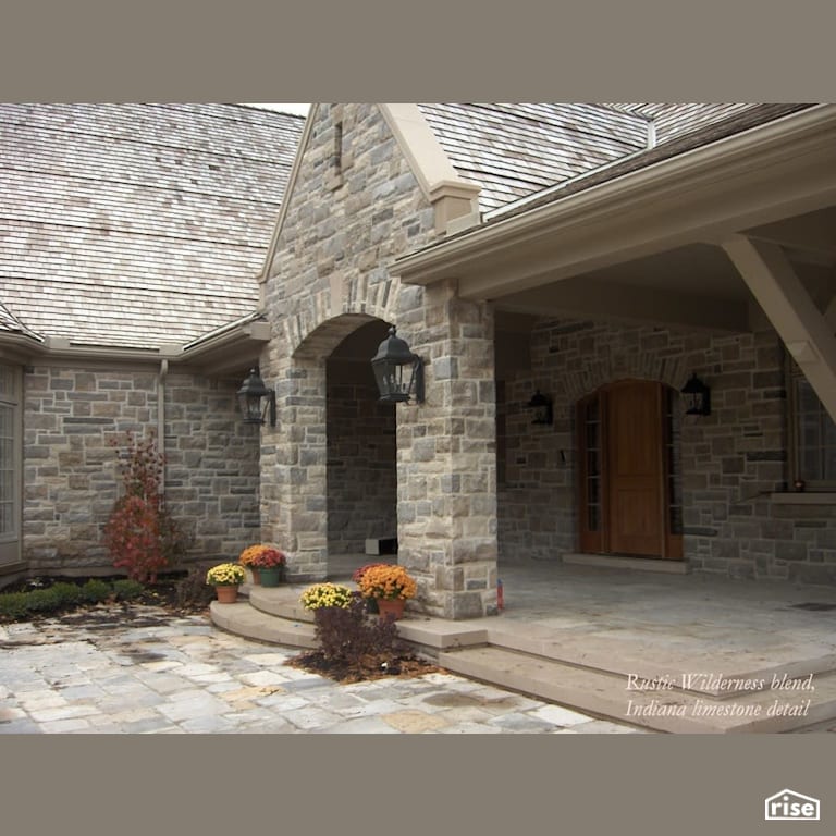 Stone home with large entryway with Stone Siding by Masonal Stone Inc