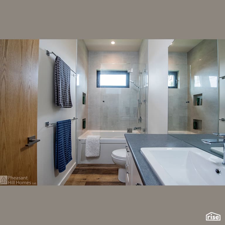 Bathroom with Low-Flow Bathroom Faucet by Pheasant Hill Homes Ltd.