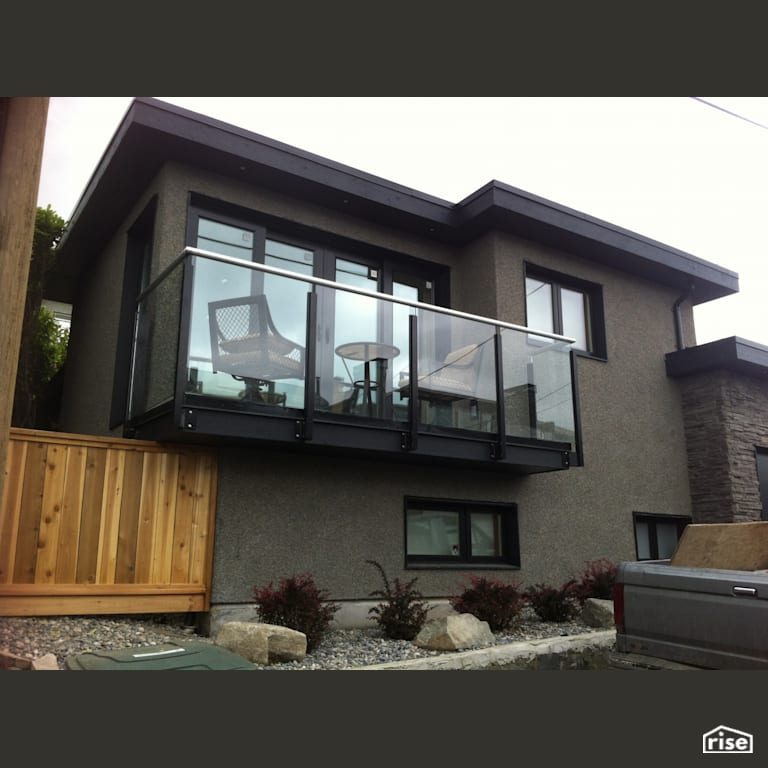 W15th Exterior  with Stone Veneer Siding by Lanefab Design/Build