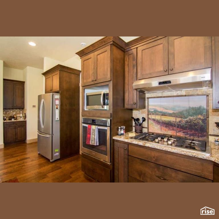 Kitchen with Gas Range by Winsome Construction