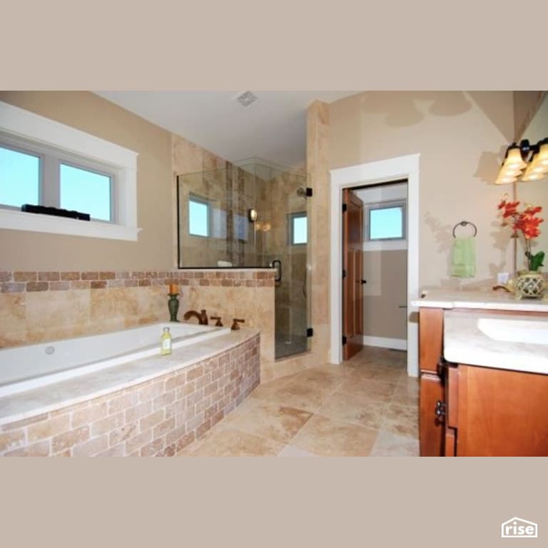 Custom home bathroom with Low-Flow Showerhead by Constructive Builders