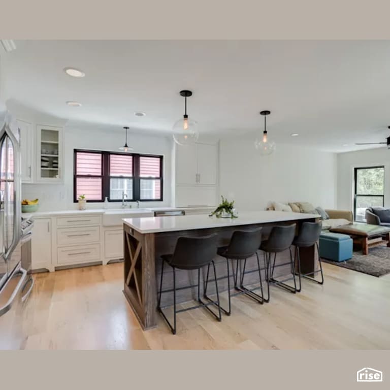 Kitchen with Laminate Flooring by Constructive Builders