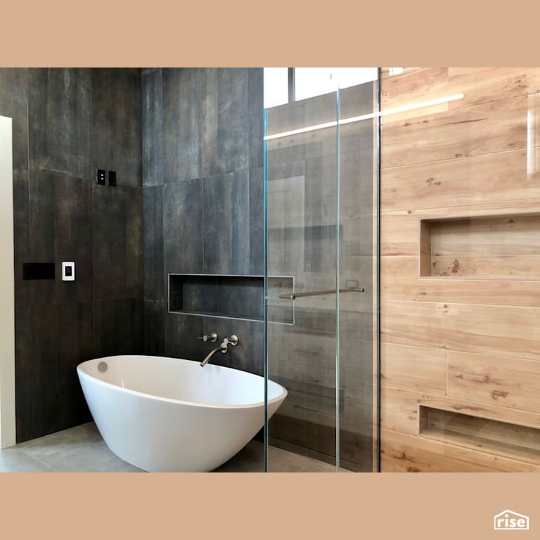 Soaker tub with large tile backdrop with Low-Flow Bathroom Faucet by Revolve Design Build