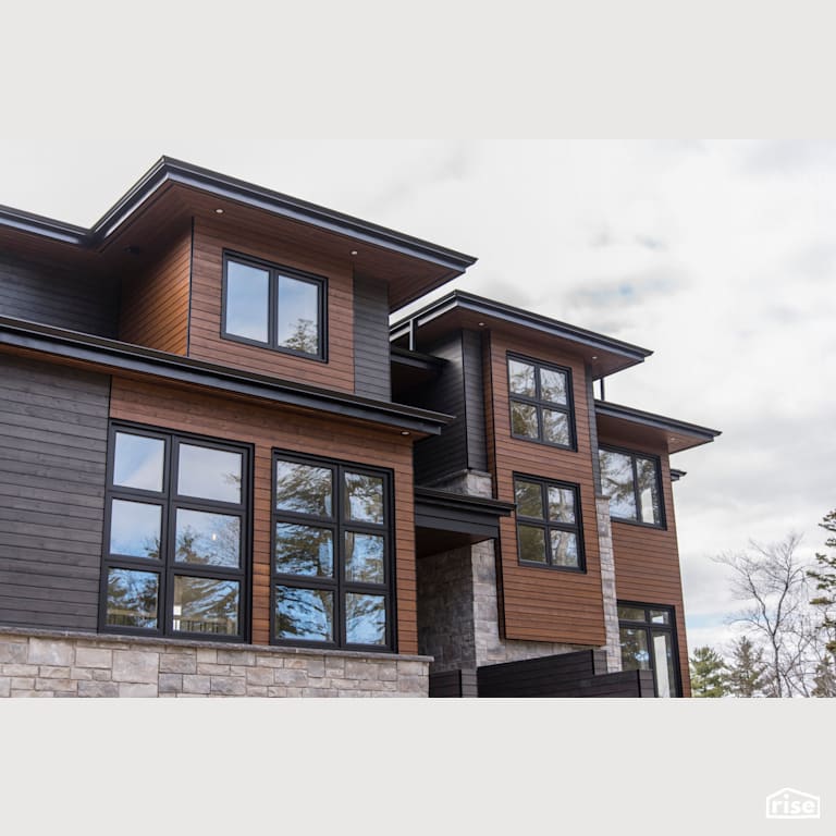 Bridge Over Water - Exterior with Brick Siding by Homes by Highgate