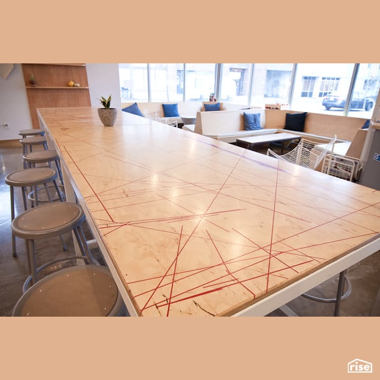 The focal point - the harvest table with Wood Veneer Cabinet by RSI Projects