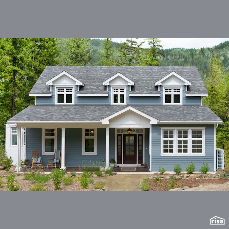 Home Exterior with Accent Outdoor Lighting by Ellenwood Homes