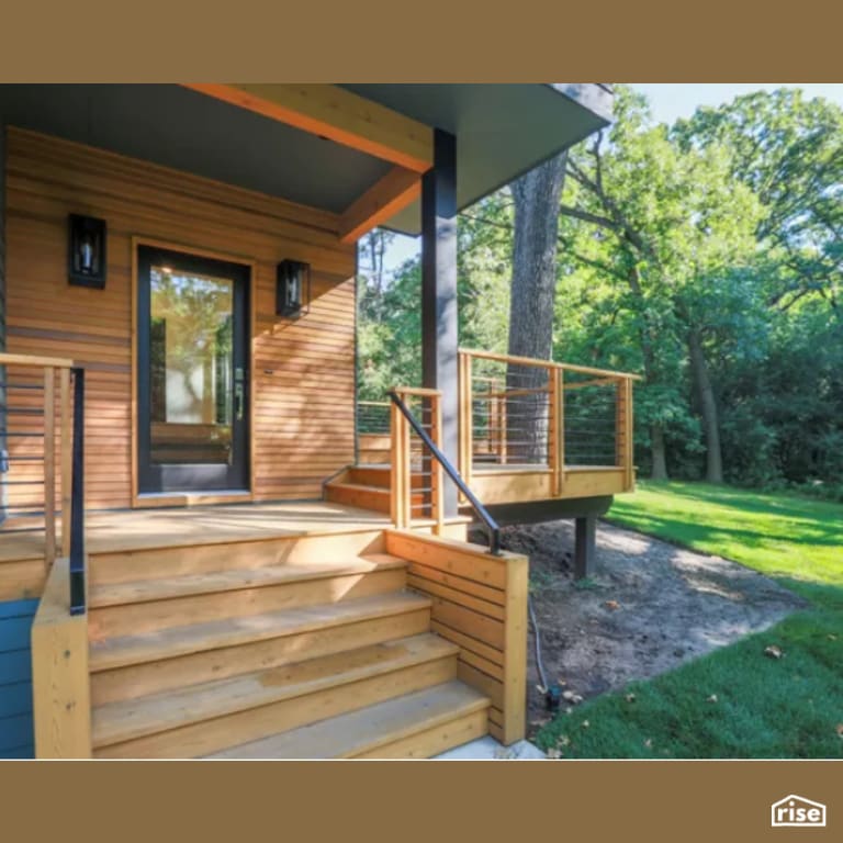 Front Door with Clapboard Wood Siding by Constructive Builders