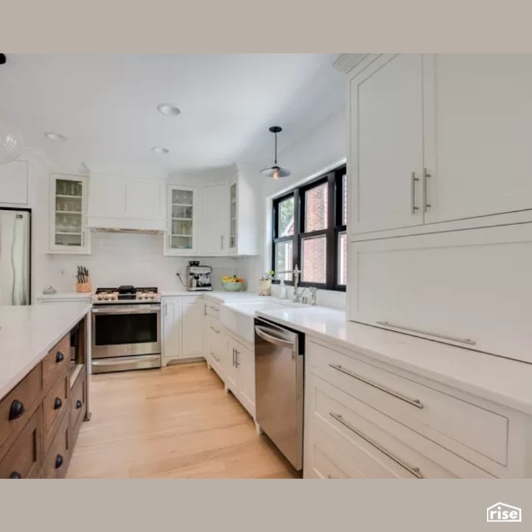 Kitchen with Gas Range by Constructive Builders