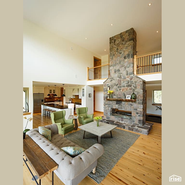 Red Castle Great Room with Kitchen with Reclaimed Hardwood by The Conscious Builder