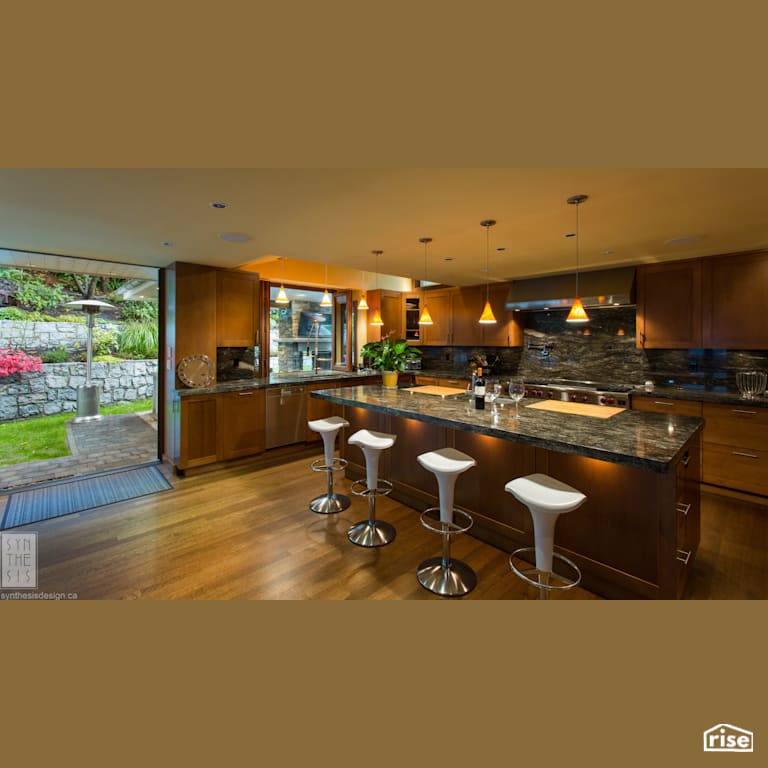 Indoor Outdoor Kitchen with Stone Countertop by Synthesis Design