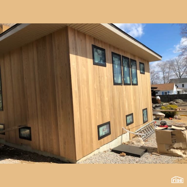 Thermally Modified Ash Alongside Black Trim Windows with Thermally Modified Wood Siding by Americana by Bingaman