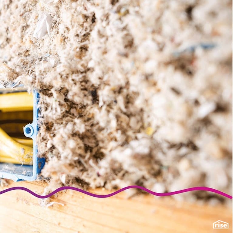 Cellulose insulation around wall plate junction with Cellulose Blown-in Insulation by Greenfiber