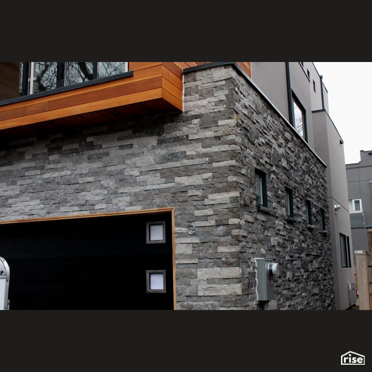 Stone and shiplap siding above garage with Fixed Window by Masonal Stone Inc