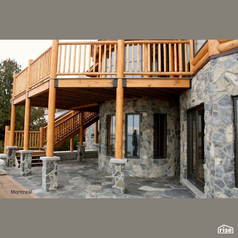 Stone house with timber decking with Cedar Decking by Masonal Stone Inc