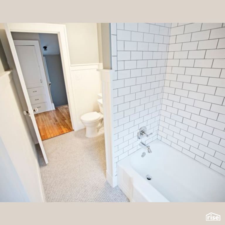 Bathroom with Low-Flow Kitchen Faucet by Constructive Builders