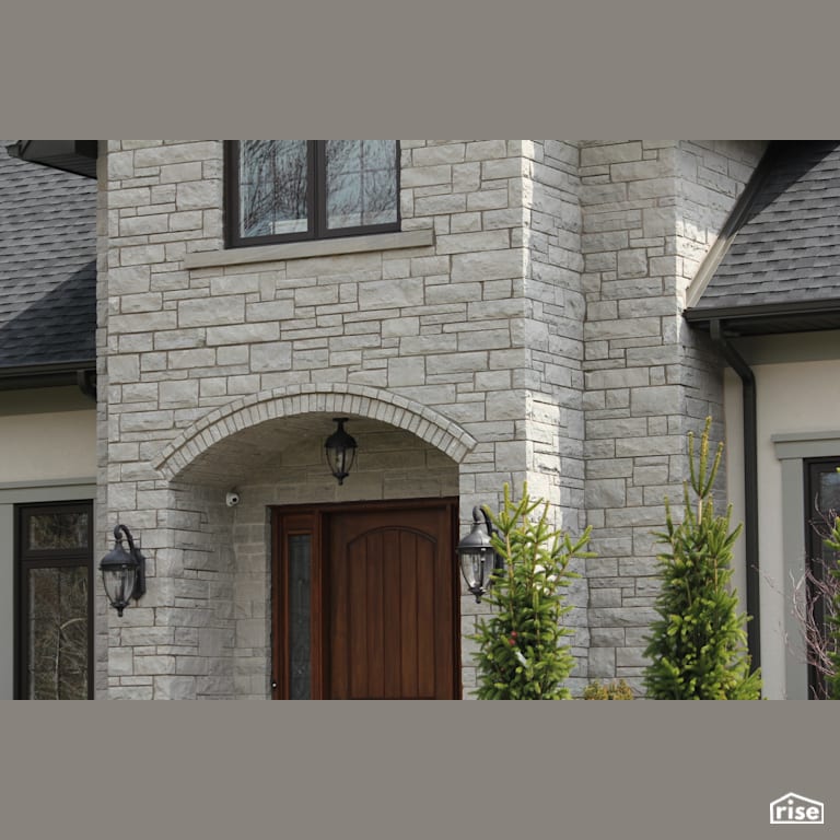 Front Exterior wall with Stone Siding with Accent Outdoor Lighting by Masonal Stone Inc