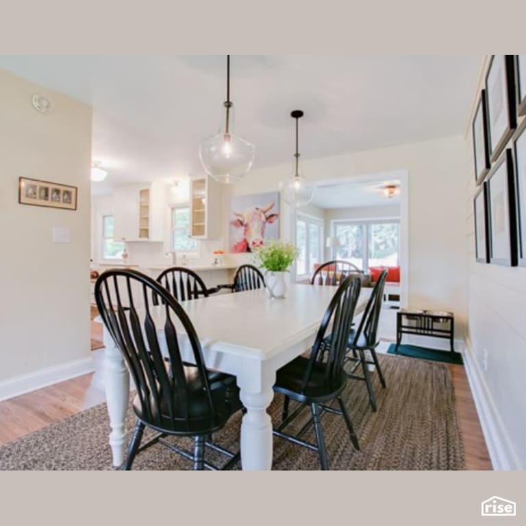 Dining Room with Laminate Flooring by Constructive Builders